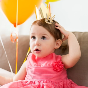 Golden mini crown hair accessory for girls with sparkling rhinestones for birthday parties