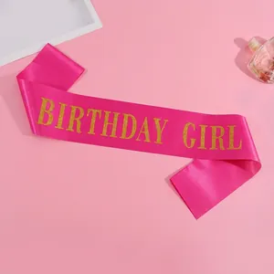 Pink satin Birthday Girl sash with gold glitter lettering for party decoration and celebration