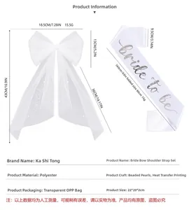 Detail of bridal bow veil with pearls and Bride to Be silver foil satin sash set