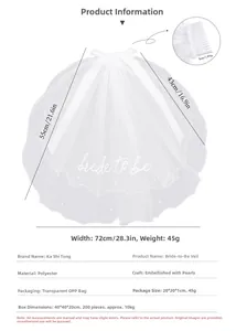 Detail showing 'bride to be' embroidery and pearl accents on the white bridal veil fabric