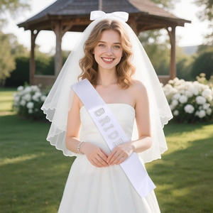 Detail of layered white bridal veil with bow and rhinestone Bride sash for bachelorette party
