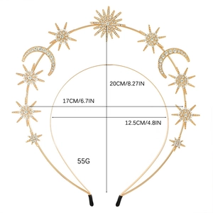 Golden Baroque star and moon headband set with rhinestones on a white background