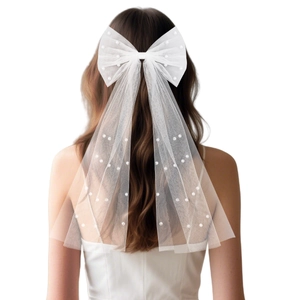 Elegant white tulle bow hair clip with pearls and long ribbons for bridal hairstyles
