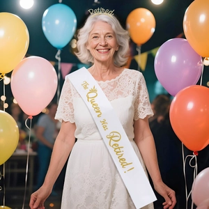 Retirement party set featuring a gold crown and white sash for the retired queen