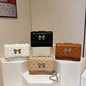 Chic quilted crossbody bags with metal bow clasp in white, black, tan, and beige colors