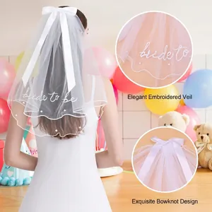 Double-layer bridal veil with satin bow, pearls, and Bride To Be embroidery detail