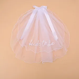 Short double-layer white bridal veil with pearl accents and Bride To Be embroidery