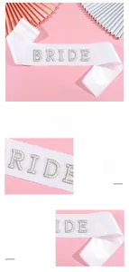 Detailed view of white satin bridal sash featuring intricate pearl and crystal BRIDE lettering