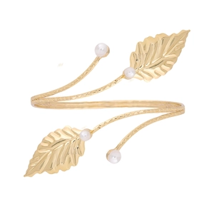 Golden leaf arm cuff with white pearls featuring Greek goddess baroque style design