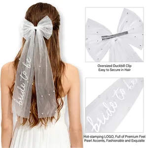 White bridal bow hairclip with bride to be lettering and pearls for wedding party