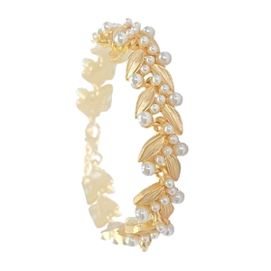 Baroque golden leaf arm bracelet with elegant white pearls and adjustable clasp