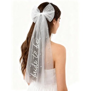 Detail of Bride to Be veil with pearl bow and white mesh for bachelorette party