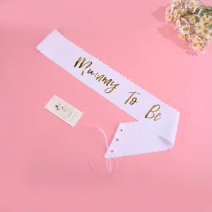 White Mummy To Be sash with gold lettering and pink ribbon for baby shower party