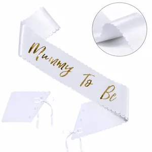 White Mummy To Be satin sash with gold foil text and wavy edges including ribbon tie