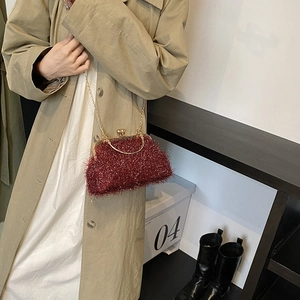 Chic red fuzzy crossbody bag with golden heart clasp and chain strap for women