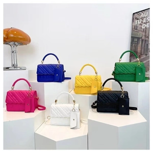 Vibrant embossed PU leather shoulder bags in six colors with mini pouch on stands