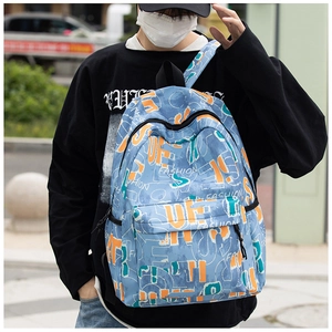 Close-up of sky blue graffiti backpack with fashion letter prints on high-quality canvas