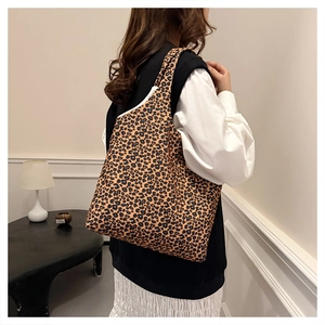 Detail of leopard print canvas tote bag showing the fabric texture and spacious interior