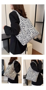 Detail view of large canvas tote bag featuring stylish black and white leopard print