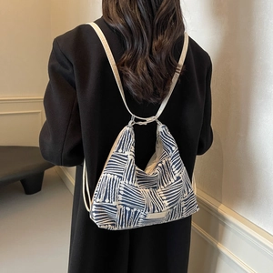 Spacious striped canvas tote bag with creative cross-strap design for women