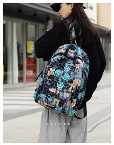 Fashionable graffiti backpack with orange and blue lettering on durable canvas material