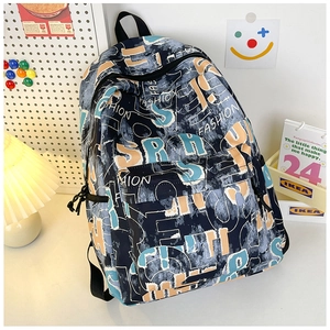 Detail of navy blue graffiti backpack with dual zippers and durable canvas texture