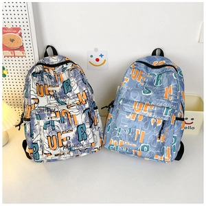 Close-up of graffiti print backpacks with large front pockets and canvas texture detail