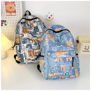 Detail of the graffiti printed backpack showing side pockets and large capacity design