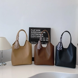 Three minimalist faux leather bucket bags in khaki, coffee, and black with silk scarves