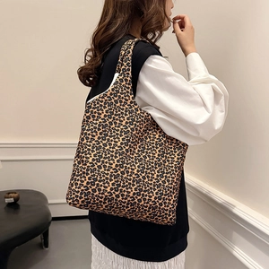 Retro leopard print canvas tote bag for women showing the stylish shoulder carry style