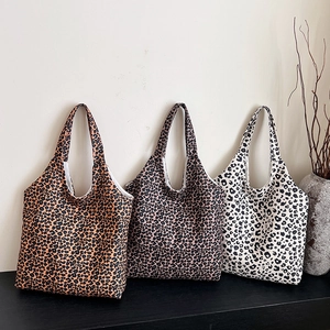 Three leopard print canvas tote bags in brown, grey, and white, stylish large shoulder bags