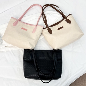 Three stylish large-capacity tote bags in various colors with geometric embossed texture