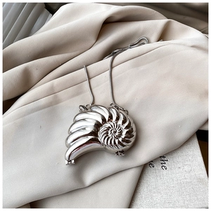 Macro shot of silver nautilus bag showing metallic texture and mirror polish finish