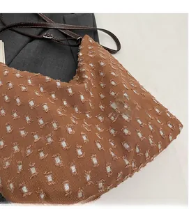 Detailed macro view of vintage textured canvas tote bag with shiny silver sequins