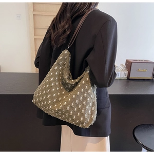 Artistic olive green tote featuring distressed square holes and frayed canvas textures