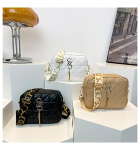Three quilted crossbody bags in black, white and khaki with wide jacquard straps
