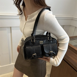 Classic black leather bowling bag with gold buckle pockets and Akobia People logo