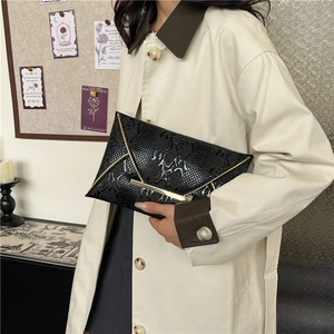 Chic black crocodile embossed envelope clutch bag with gold metal trim for women