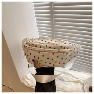 Polka dot waist bag with colorful patterns, zipper pockets and adjustable white strap