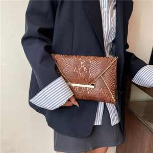 Brown snakeskin envelope clutch bag with gold V-trim and metallic clasp for women