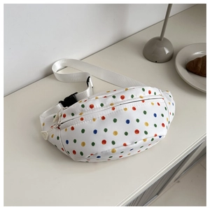 Detailed top view of a white canvas waist bag featuring colorful polka dot prints