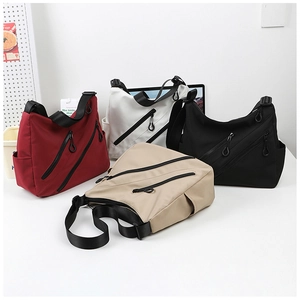 Multiple views of large nylon crossbody bags in red, white, black and beige colors