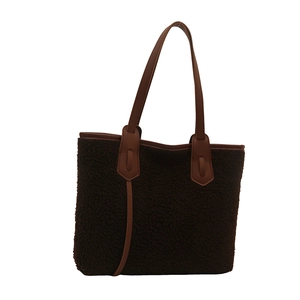 Large brown lamb wool tote bag with leather trim and spacious interior for women