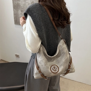 Large grey canvas hobo bag with vintage wash, leather straps and metal M logo