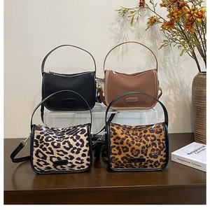 Collection of vintage matte tote bags in solid black, brown, and leopard print textures
