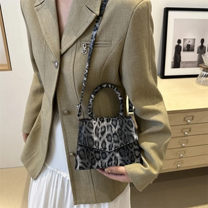 Elegant leopard print crossbody bag with top handle and vintage style for women