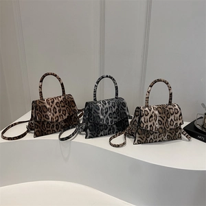 Three elegant leopard print square handbags in brown and grey with top handles and straps