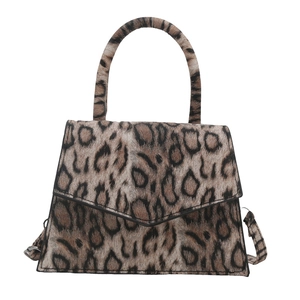 Elegant leopard print trapezoid handbag with a top handle and adjustable shoulder strap