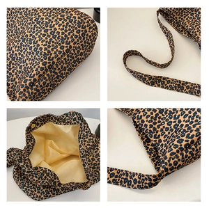 Detail view of leopard print tote bag with wide straps, magnetic buckle, and soft lining
