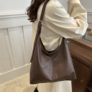 Minimalist deep brown faux leather hobo shoulder bag with adjustable wide strap for women